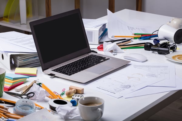 A desk that needs cleaning and sanitizing services