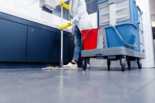 A professional crew member performs commercial cleaning services