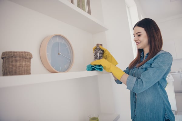 A woman does seasonal cleaning of her second home.